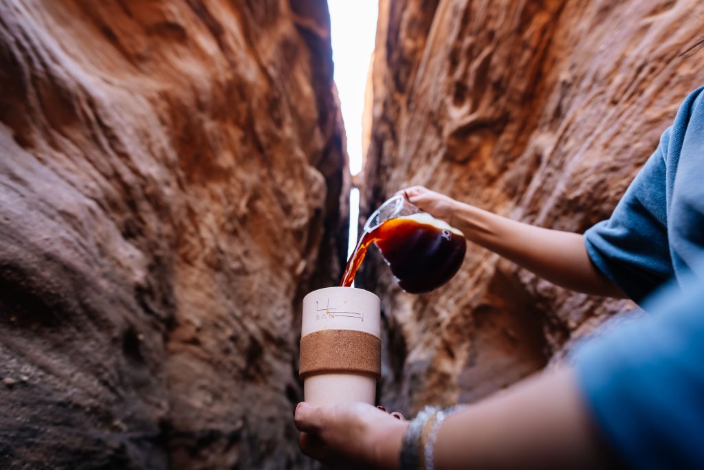 BAN hospitality: a branded cup inside a rock canyon in AlUla