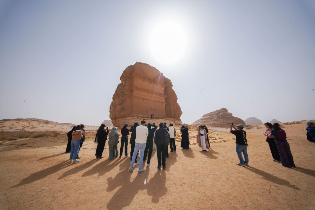 BAN guests in front of a tomb at Hegra, AlUla